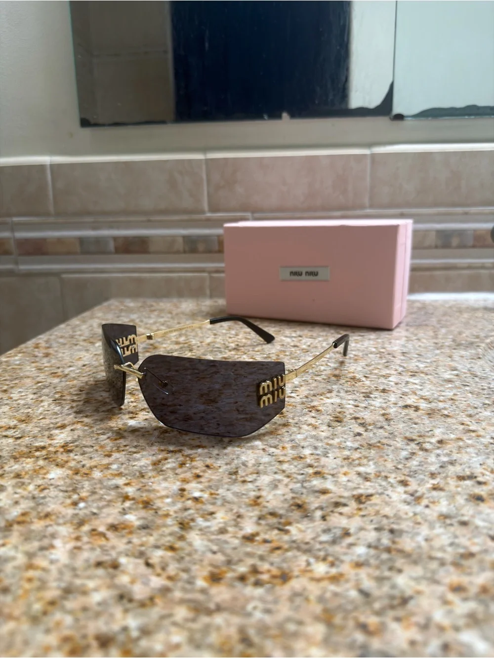 Miu Miu Rimless Sunglasses with Black Lenses and Gold Temples